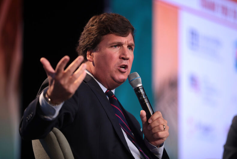 Tucker Carlson s'entretient avec les participants au Sommet d'action des étudiants 2018 organisé par Turning Point USA au Palm Beach County Convention Center à West Palm Beach, en Floride.