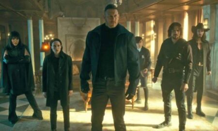 The cast of the Umbrella Academy stand together on set