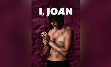 A graphic of a person who is covered in dirt and grime, their chest is bound and they wring their hands. A chainmail helmet covers their eyes. They stand in front of a purple background with text above their head reading I, JOAN in large white letters.