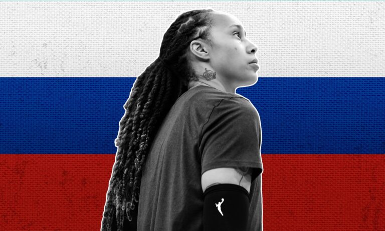 Brittney Griner infront of the Russian flag.