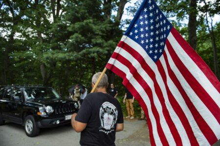 Members of CORR, some armed, run security at the event entrance of the second annual Refounding Fathers Festival in Auburn, Massachusetts, on August 6, 2022.