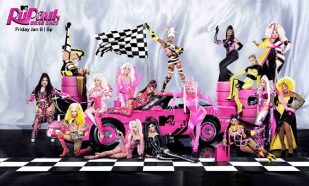 A promotional picture of Drag Race Season 15 showing all the new drag queens posing around a pink sports car