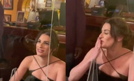 A fan records a video while talking to Lea Michele