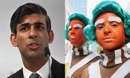 On the left, Rishi Sunak in a white shirt speaks into a microphone. On the left, two people dressed up as Oompa Loompas.