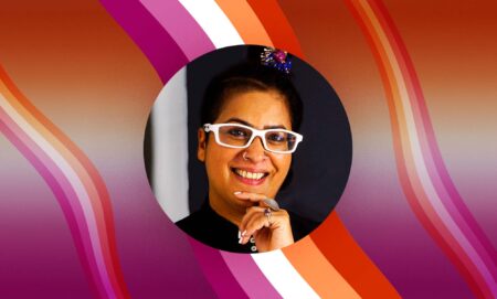 Author and entrepreneur Raga D'silva with lesbian Pride colours pictured behind her.