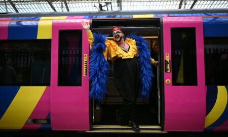 A Eurovision super-fan arrives at Lime Street Station in Liverpool, northern England on May 9, 2023, ahead of the first semi-final of the Eurovision.