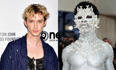 On the left, Troye Sivan in a black top and blue jacket. On the left, Lil Nas X painted silver head to toe.