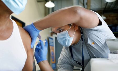 A person receives a vaccine.