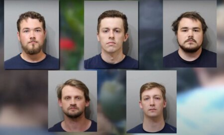 Five members of Patriot Front are depicted on screen with their mug shots after being arrested for planning to riot at an LGBTQ+ Pride event in Idaho