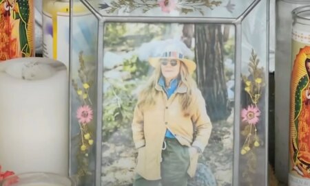 A picture of California store owner Laura Ann Carleton in a frame with flowers set up during a memorial after Carleton was fatally shot by an unidentified man who made