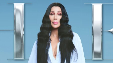 Cher with long black hair and a white shirt on the cover her her album