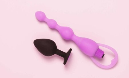 Butt plugs on a pink background.