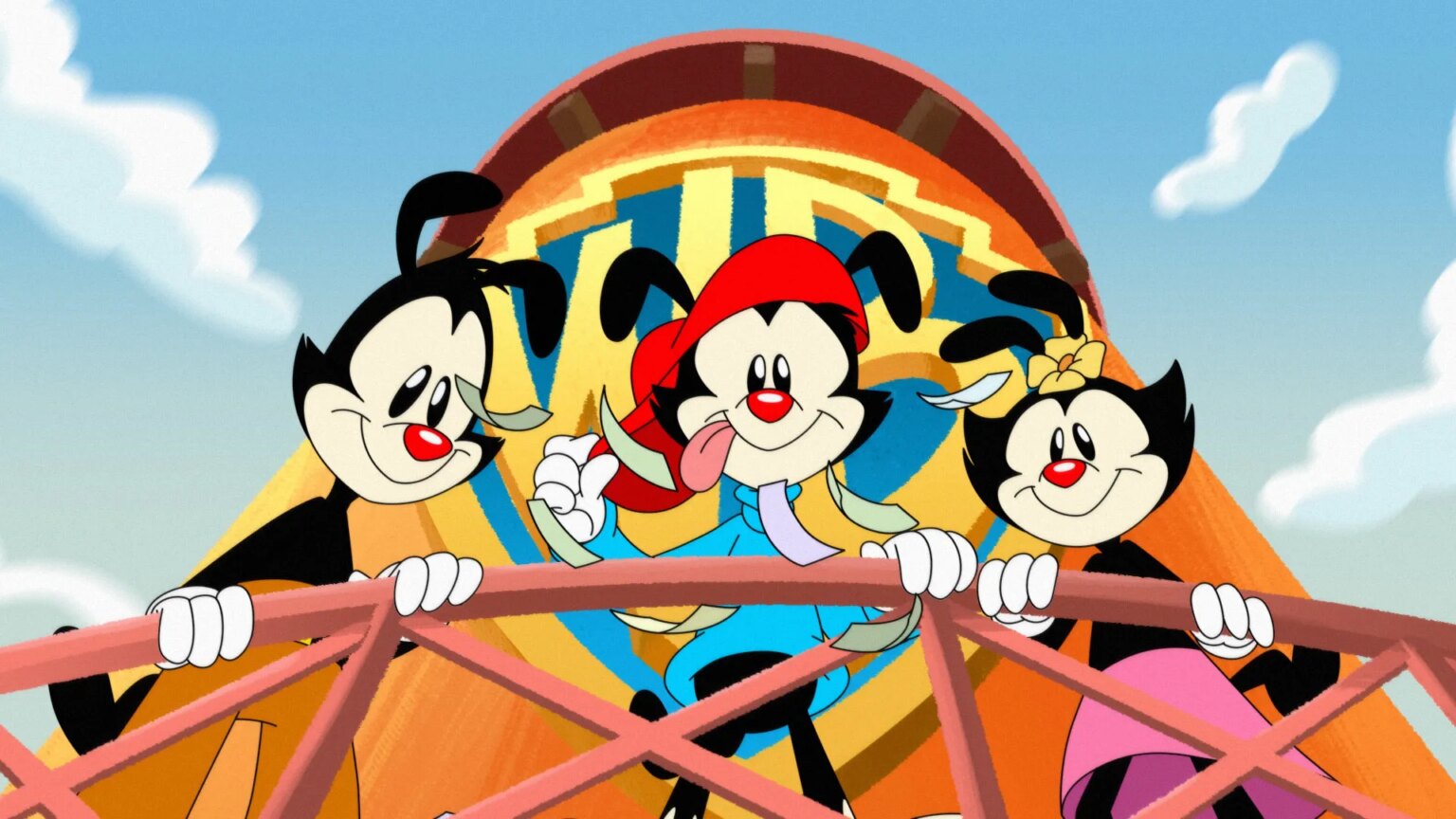 Les fanatiques sont maintenant en colère contre un redémarrage d’Animaniacs, vieux de quatre ans, parce que bien sûr, ils sont Cartoon image shows three animated characters called Yakko, Wakko and Dot, who are hanging over the balcony of a water tower emblazoned with the Warner Brothers logo.