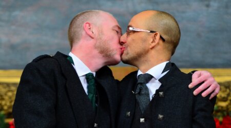 GLASGOW, SCOTLAND - DECEMBER 30: A couple of the same sex Joe Schofield (R) and Malcolm Brown from Tullibody, Clackmannanshire pose for a photograph and will marry at the Trades Hall the ceremony conducted by Ross Wright, from the Humanist Society Scotland shortly after midnight in front of friends and family in one of the first same-sex and belief category weddings in Scotland on December 30, 2014 in Glasgow, Scotland. Same-sex couples have been able to enter into 'civil partnerships' since 2005, however following a change in the law on February 4, 2014. A couple of the same sex are now eligible to marry in Scotland. Parliament's decision to grant same-sex couples an equal right to marriage has been met with opposition from religious groups. (Photo by Mark Runnacles/Getty Images)