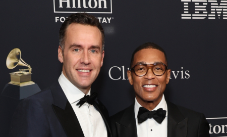 Tim Malone and Don Lemon smiling on a red carpet