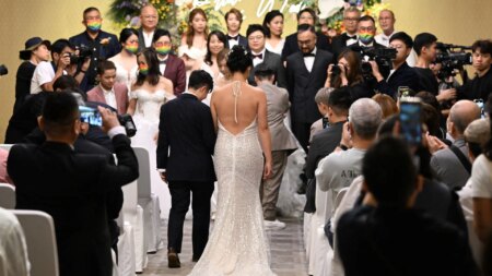 Ten LGBTQ+ couples stage mass wedding in Hong Kong despite same-sex marriage being illegal