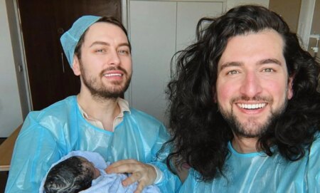 Brian Dowling (left) and Arthur Gourounlian (right) with their new baby