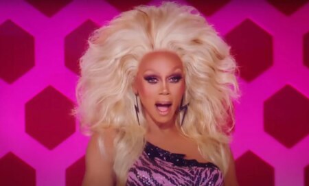 RuPaul on the drag race judging panel looking shocked and gagged.