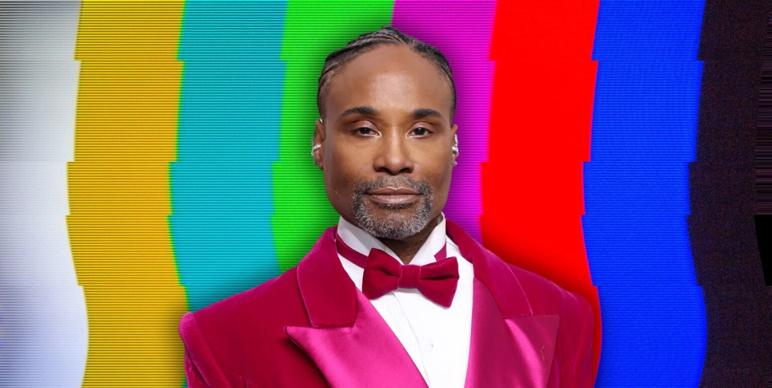 Billy Porter pleure les progrès réalisés dans la représentation des homosexuels : « Cela me coupe le souffle » Billy Porter in his pink gown at the 2023 golden globe awards against a tv static background.