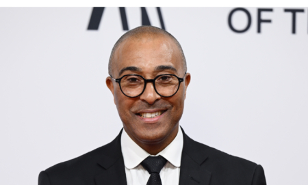 Colin Jackson at the BBC Sports Personality Of The Year 2023, wearing a suit and smiling at the camera.