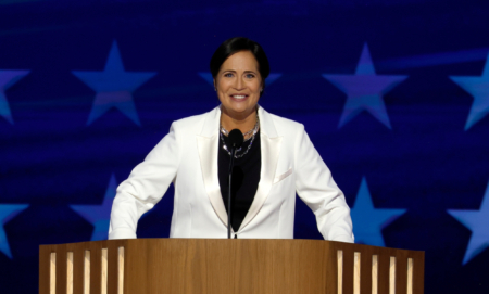 Former Trump White House Press Secretary Stephanie Grisham speaks on stage during the second day of the Democratic National Convention