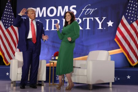 U.S. President Donald Trump (L) and Co-founder of Moms for Liberty Tiffany Justice (R)