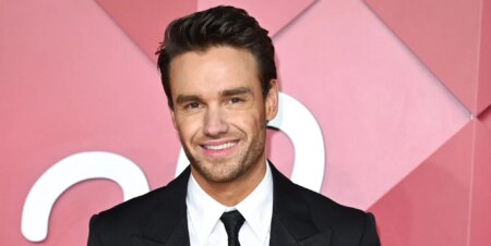 Liam Payne smiles on a red carpet in 2022.