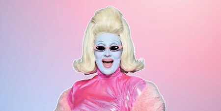 Drag star Juno Birch against a pink and blue background
