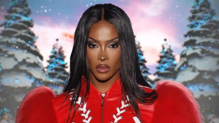 Tayce in a red, puffy sleeved dress, against a snowy background
