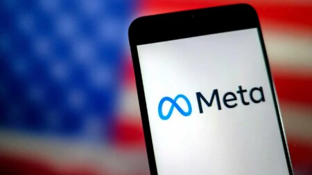 An illustration photo shows the Meta LOGO displayed on a smartphone, an American flag is behind it