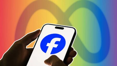 A smartphone displays the Facebook logo, with the Meta logo in the background