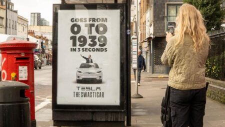 A poster at a London bus stop reading