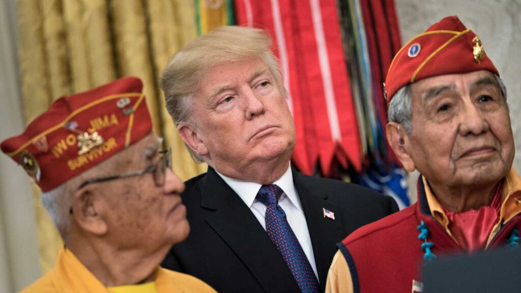 US President Donald Trump listens with Navajo Code Talkers in the Oval Office of the White House in November 2017.