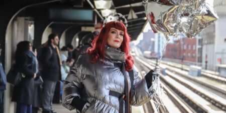 Ana Matronic at a train station holding a balloon