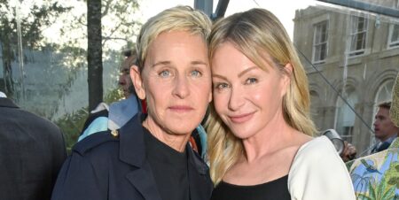 Ellen DeGeneres and Portia De Rossi smile and pose together in 2023.