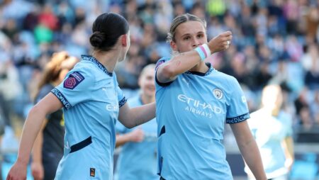 Kerstin Casparij of Manchester City kisses her wrist as she celebrates scoring her team