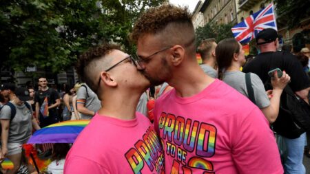 Two men kiss during the Budapest Pride Parade in Budapest, Hungary on June 22, 2024.
