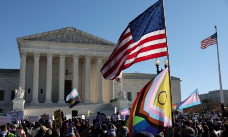 The American and Progress Pride flags outside of the Supreme Court.