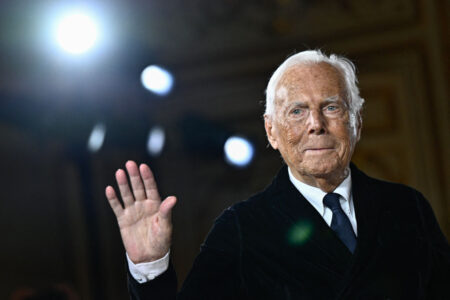 Italian designer Giorgio Armani acknowledges the applause at the end of his presentation for Armani Prive during the Women's Haute-Couture Spring/Summer 2025 Fashion Week to mark its 20th anniversary, in Paris on January 28, 2025. (Photo by JULIEN DE ROSA / AFP) (Photo by JULIEN DE ROSA/AFP via Getty Images)