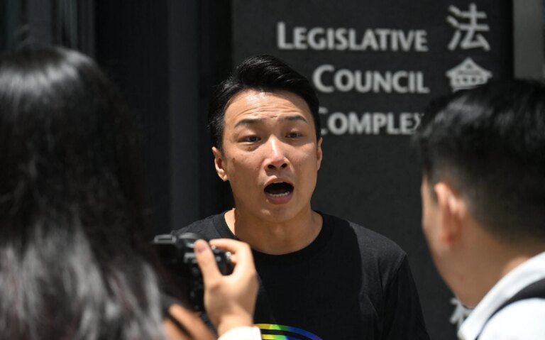 Hong Kong pro-democracy and LGBTQ rights activist Jimmy Sham speaks to reporters outside the Legislative Council Complex in Hong Kong on September 10, 2025. Hong Kong lawmakers are expected to vote September 10 on whether to grant limited rights to same-sex couples, as fears grow in the LGBTQ community that even this narrow equality bid could be sunk by conservative pro-Beijing voices.