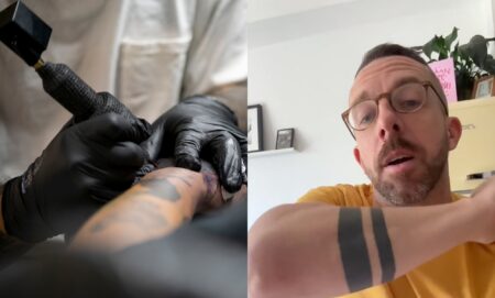 A tattoo artist working and a man with a double armband tattoo