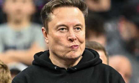 Elon Musk, pictured pursing his lips.