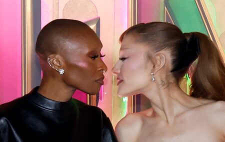 Cynthia Erivo and Ariana Grande leanming in to walkt to each other at the Wicked: For Good! premiere
