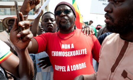 A Senegalese man wearing a Occitan shirt reading