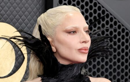 Lady Gaga attends the 68th GRAMMY Awards, wearing a black feathered dress