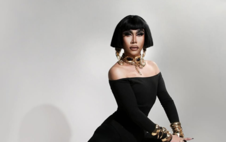 Drag Race: Philippines star Misua in a black dress and chunky gold jewellery