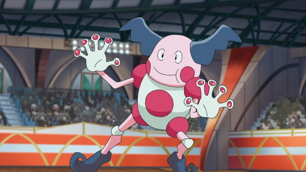 M. Mime, un Pokémon ressemblant à un clown avec deux mèches de cheveux bleues en forme d'ailes et des doigts en forme de ventouse.