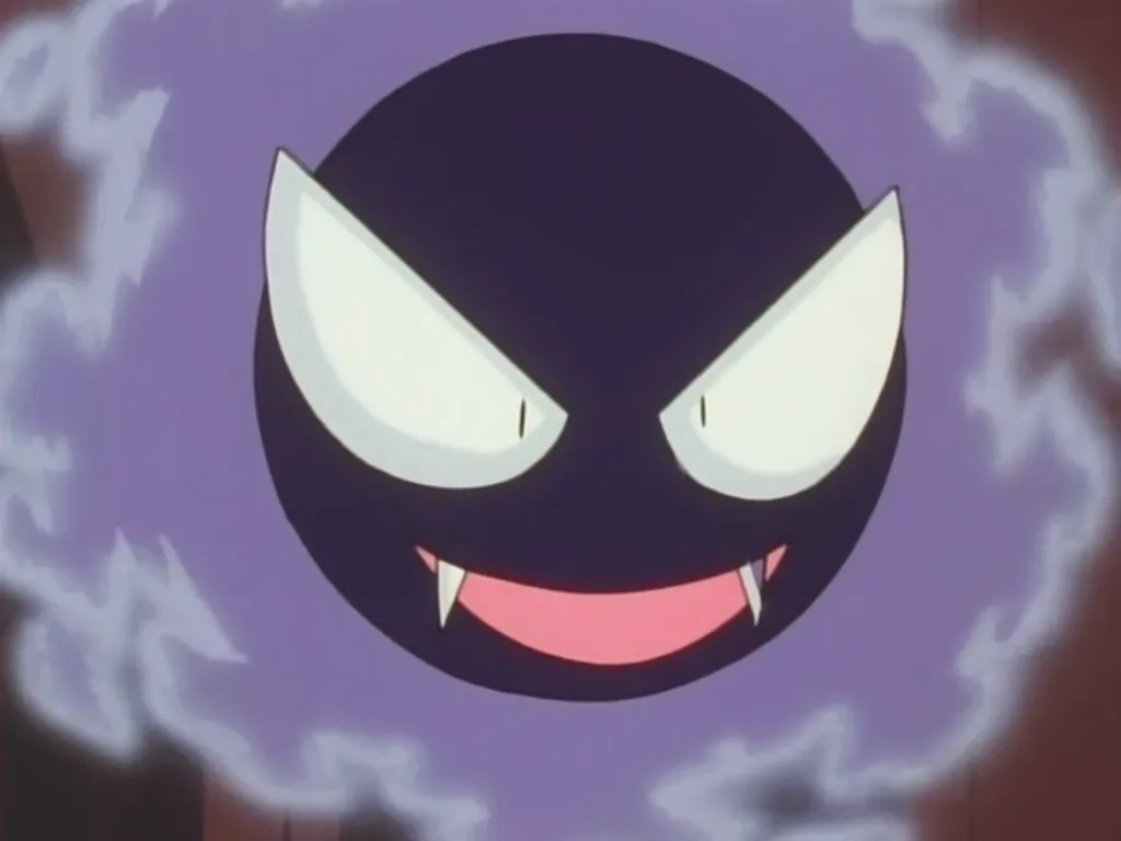 Gastly, une boule noire aux énormes yeux bridés, enveloppés de fumée violette, aux dents acérées.